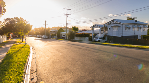 a quiet suburban street at sunset with golden light - Australian Stock Image