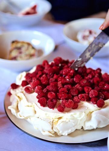 A raspberry pavlova served at Christmas lunch - Australian Stock Image