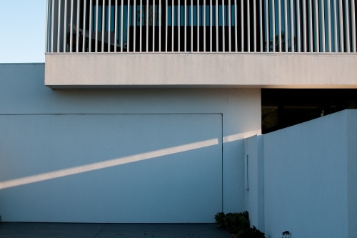 A ray of diagonal light beams across a modern house
