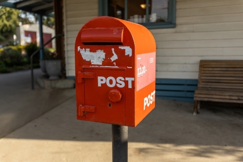 A red australia post letter box stripped of all branding and logos. - Australian Stock Image