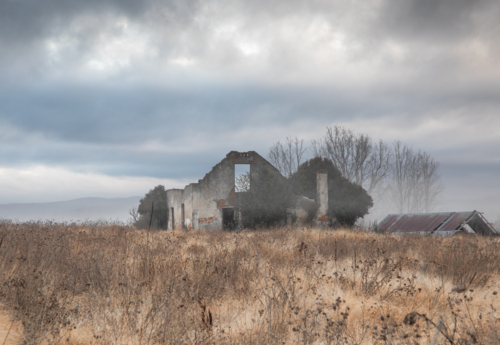 A relic of an historic old building and a grey sky - Australian Stock Image