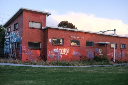 A scout hall covered in graffiti