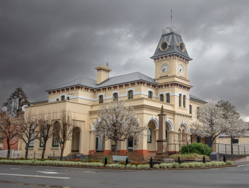 A small town country Post Office building under a stormy grey sky - Australian Stock Image