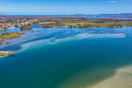 A sweeping aerial view of Wallis Lake and the town of Forster - Australian Stock Image