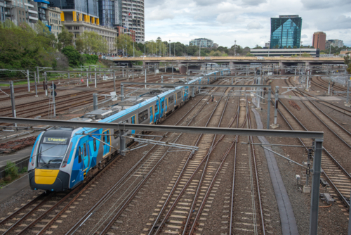A train on the tracks near Flinders Street Station in Melbourne - Australian Stock Image