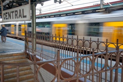 A train travels through Central Station in Sydney with motion blur - Australian Stock Image