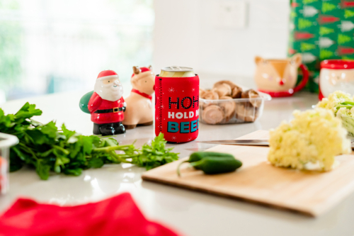 A vibrant kitchen filled with Christmas decorations and fresh ingredients for holiday cooking - Australian Stock Image