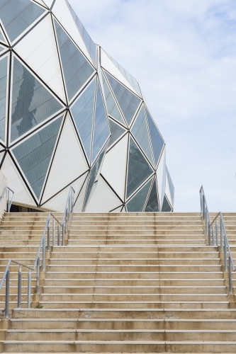 A wide staircase leading up toward a modern architectural building - Australian Stock Image