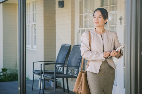 A woman leaving home to go to work - Australian Stock Image