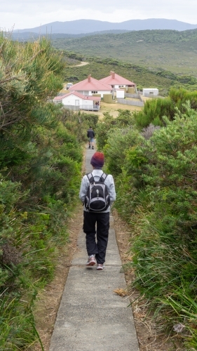 A woman walking on the track at Bruny Island Lighthouse - Australian Stock Image