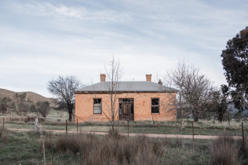 Abandoned brick house in rural location - Australian Stock Image