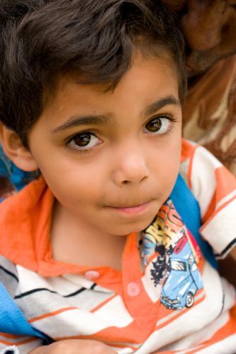 Aboriginal Boy Looking up at Camera - Australian Stock Image