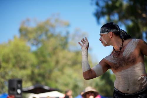 Aboriginal Dancer Emerging from Shadow - Australian Stock Image