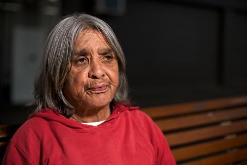 Aboriginal Elder in Red Top - Australian Stock Image