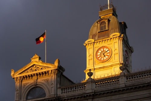 Aboriginal flag flying above a heritage building - Australian Stock Image