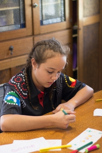 Aboriginal Girl writing