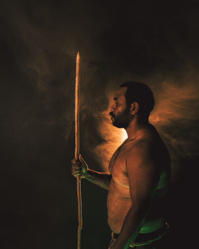Aboriginal Male portrait posing with spear - Australian Stock Image