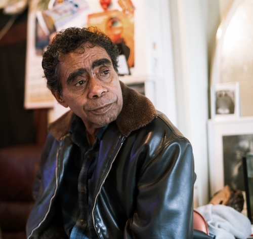 Aboriginal Man Indoors Looking Sideways - Australian Stock Image