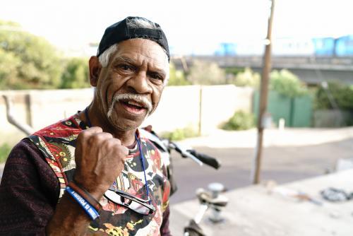 Aboriginal Man with Train in Background - Australian Stock Image