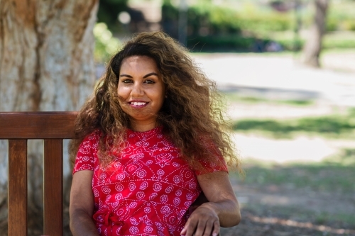 aboriginal woman on park bench