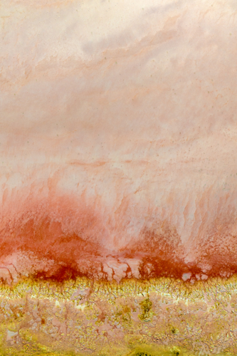 Abstract aerial view of mineral deposits and textures at the edge of a salt lake - Australian Stock Image