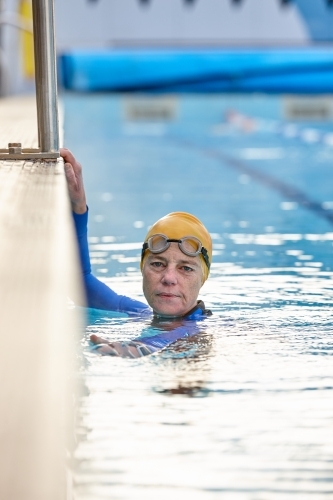 Active senior lady in swimming pool - Australian Stock Image