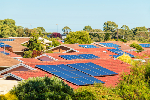 Adelaide suburb with house rooves covered by solar panels viewed on a day - Australian Stock Image