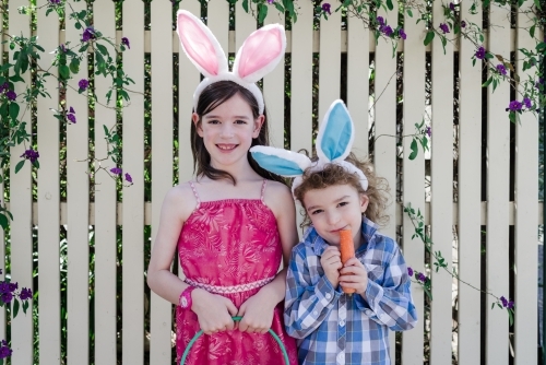 Adorable children wearing easter bunny rabbit ears - Australian Stock Image