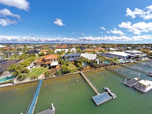 Aerial drone uav footage over waterfront properties with private jetties and solar panels in Newport - Australian Stock Image