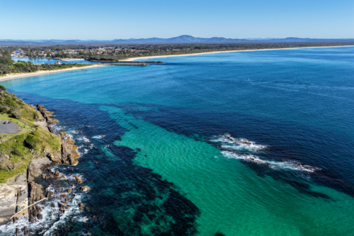 Aerial image capturing a rugged rocky coastline towards Forster and Tuncurry - Australian Stock Image