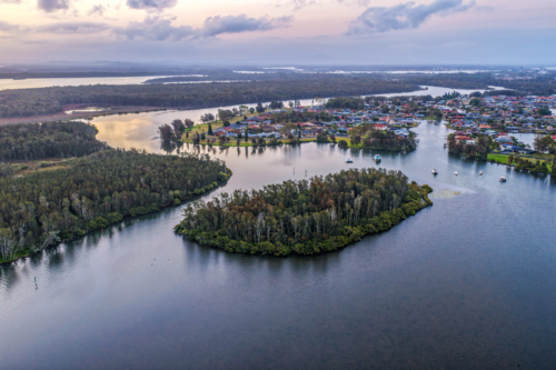 Aerial image capturing the Coolongolook River in Tuncurry at sun set - Australian Stock Image