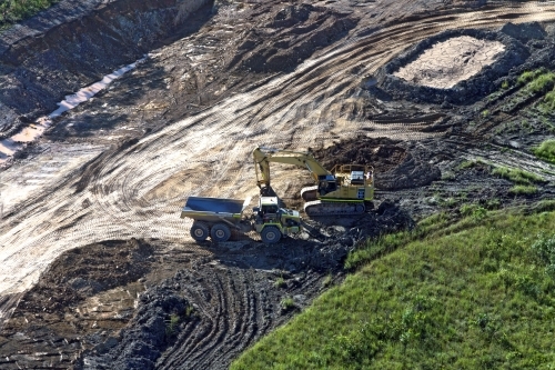 Aerial image of a truck and digger on land clearing - Australian Stock Image