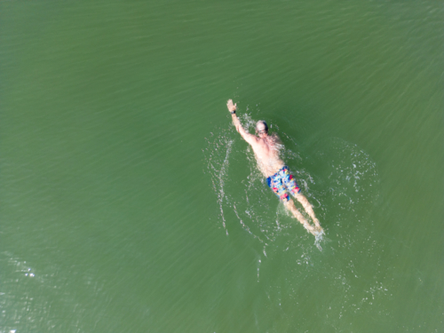 Aerial image of an open water swimmer off Suttons Beach, Redcliffe - Australian Stock Image