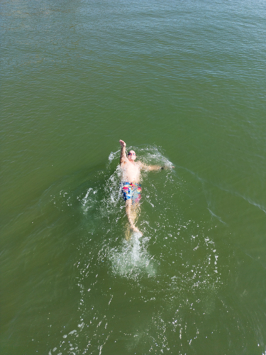 Aerial image of an open water swimmer off Suttons Beach, Redcliffe - Australian Stock Image