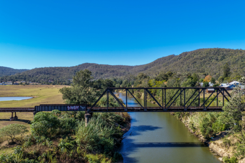 Aerial image of the Paterson railway bridge spanning the Hunter River in New South Wales Australia. - Australian Stock Image