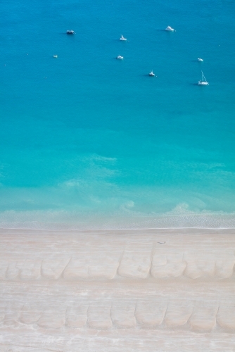 Aerial image of turquoise water and boats at Gantheaume Point - Australian Stock Image