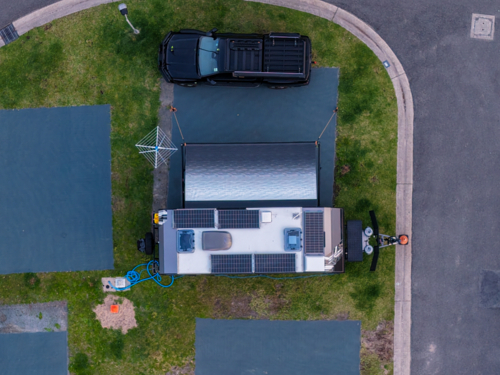 Aerial image showing a car and caravan parked in a caravan park - Australian Stock Image