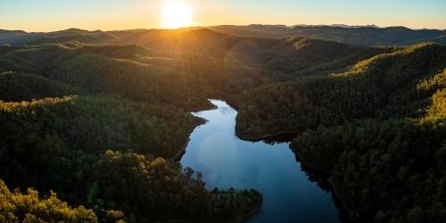 Aerial landscape of a lake surrounded by forest