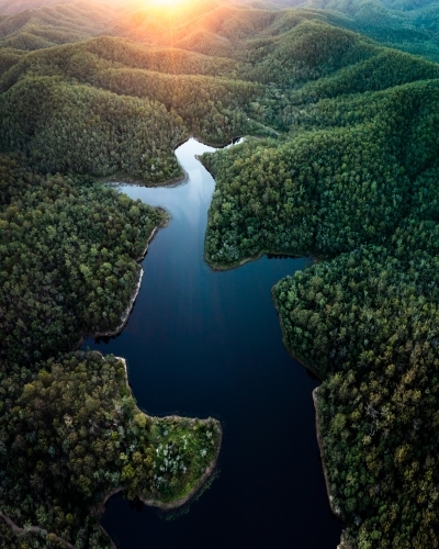 Aerial landscape of a lake surrounded by forest - Australian Stock Image