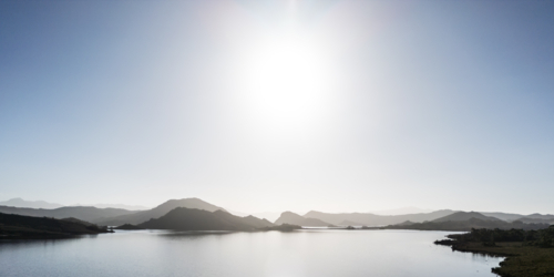 Aerial landscape of Lake Pedder on a hot summer's afternoon in Southwest National Park, Tasmania - Australian Stock Image
