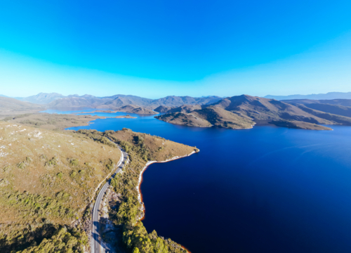 Aerial landscape of Lake Pedder on a hot summer's afternoon in Southwest National Park, Tasmania - Australian Stock Image