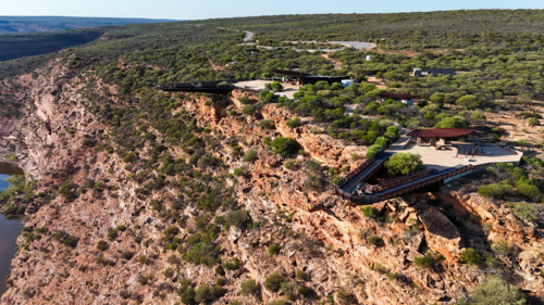 Aerial looking back on 2 A-Frame skywalks in remote rocky area - Australian Stock Image
