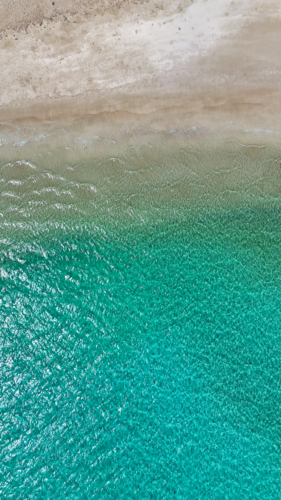 Aerial of remote beach with aqua water - Australian Stock Image