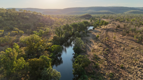 Aerial of river running through remote bushland - Australian Stock Image