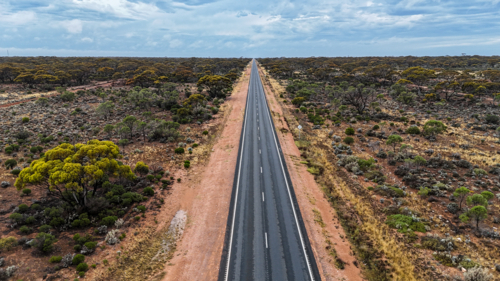 Aerial of straight road into the distance - Australian Stock Image
