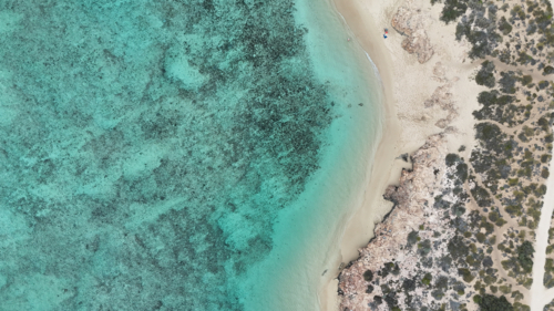 Aerial of the reef meeting the land - Australian Stock Image