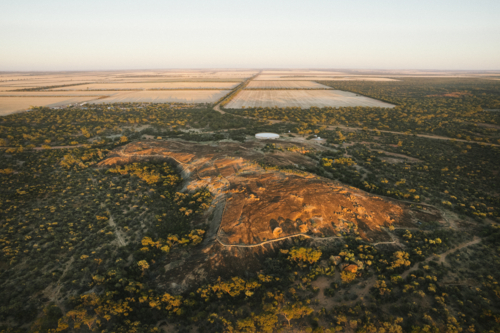 Aerial over Beringbooding Rock at sunrise in the eastern Wheatbelt of Western Australia - Australian Stock Image