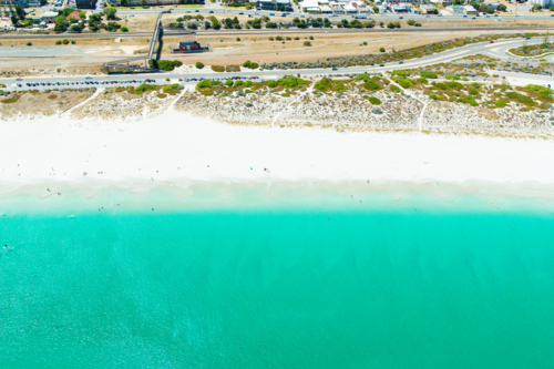Aerial over white sandy turquoise beach Perth Western Australia - Australian Stock Image