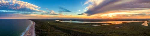 Aerial panorama looking out over the coast of Bribie Island at sunrise