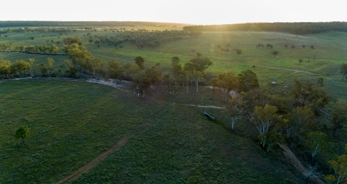 Aerial panorama of a farm creek at dusk. - Australian Stock Image